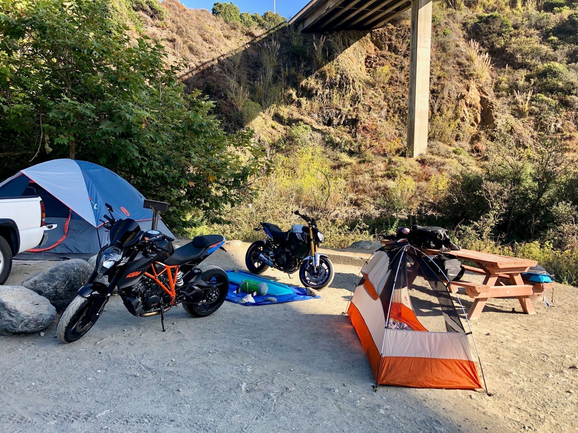 Image of motorcycles at a campsite