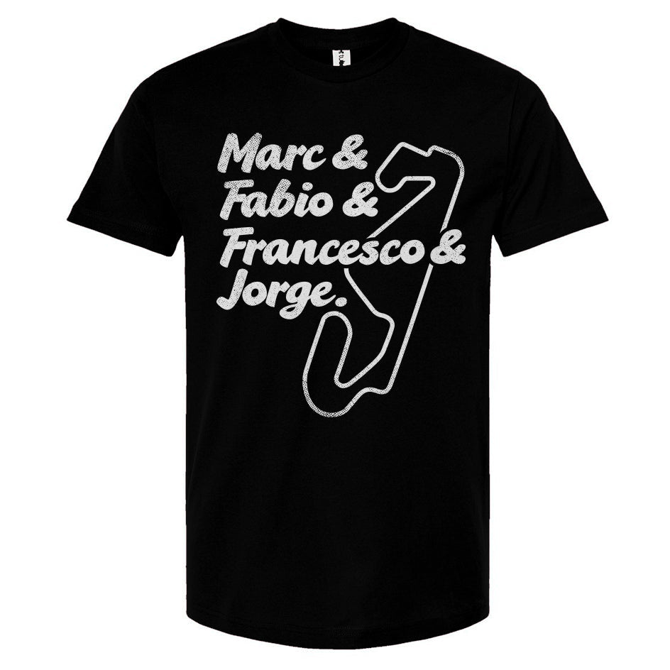 Black t-shirt with white text and graphics featuring the names of MotoGP champions and a track map.