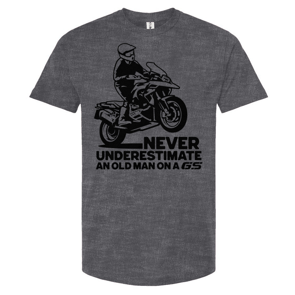 T-shirt with a man wheelie on a GS motorcycle sitting proudly with text below saying "never underestimate an old man on a gs"
