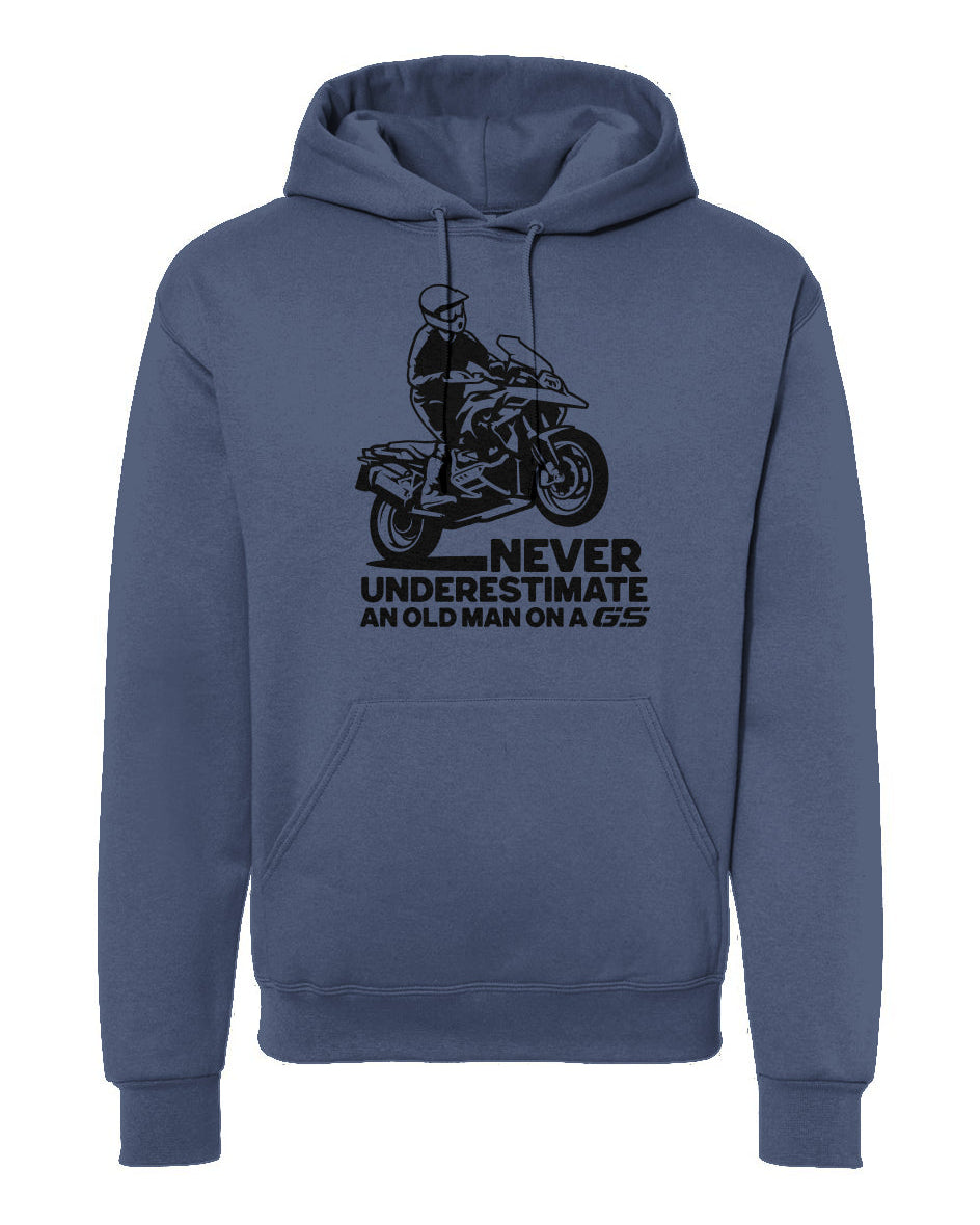 A navy blue hoodie with a graphic print of a motorcycle and the text 'NEVER UNDERESTIMATE AN OLD MAN ON A GS'.