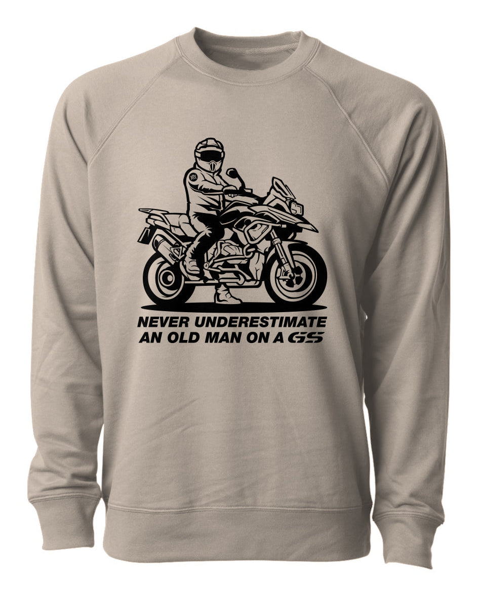 crewneck sweatshirt with an graphic print of a man on a motorcycle and the text 'NEVER UNDERESTIMATE AN OLD MAN ON A GS'.