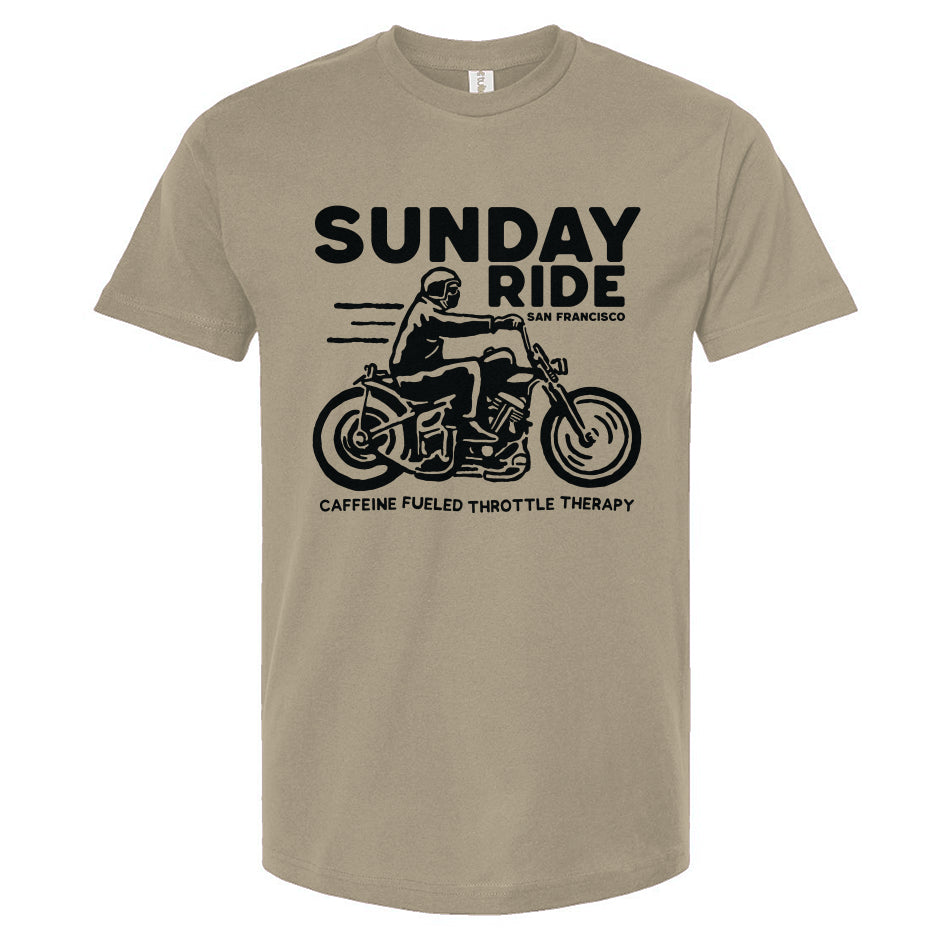Sand colored t-shirt with black 'Sunday Ride' graphic and text on a white background