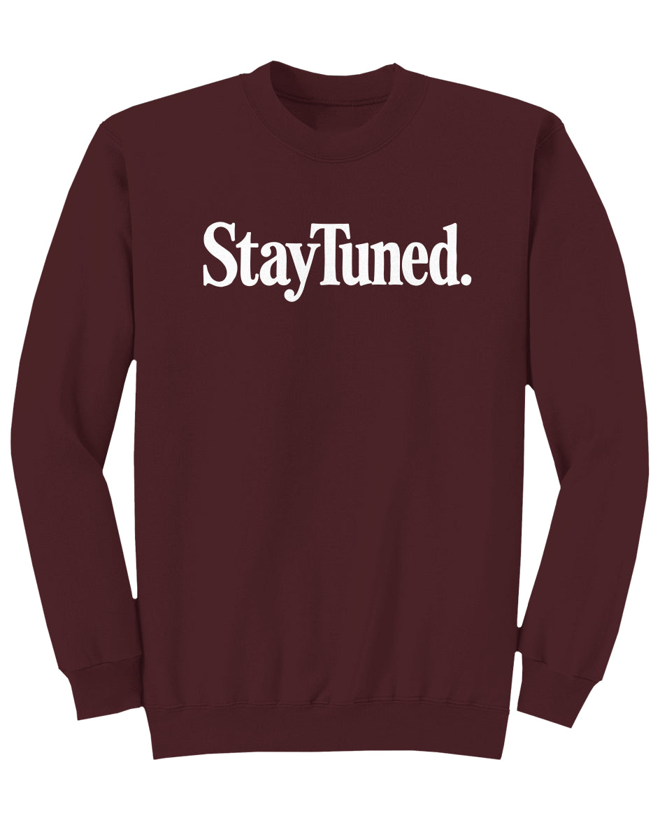 Maroon sweatshirt with 'StayTuned.' text on a white background