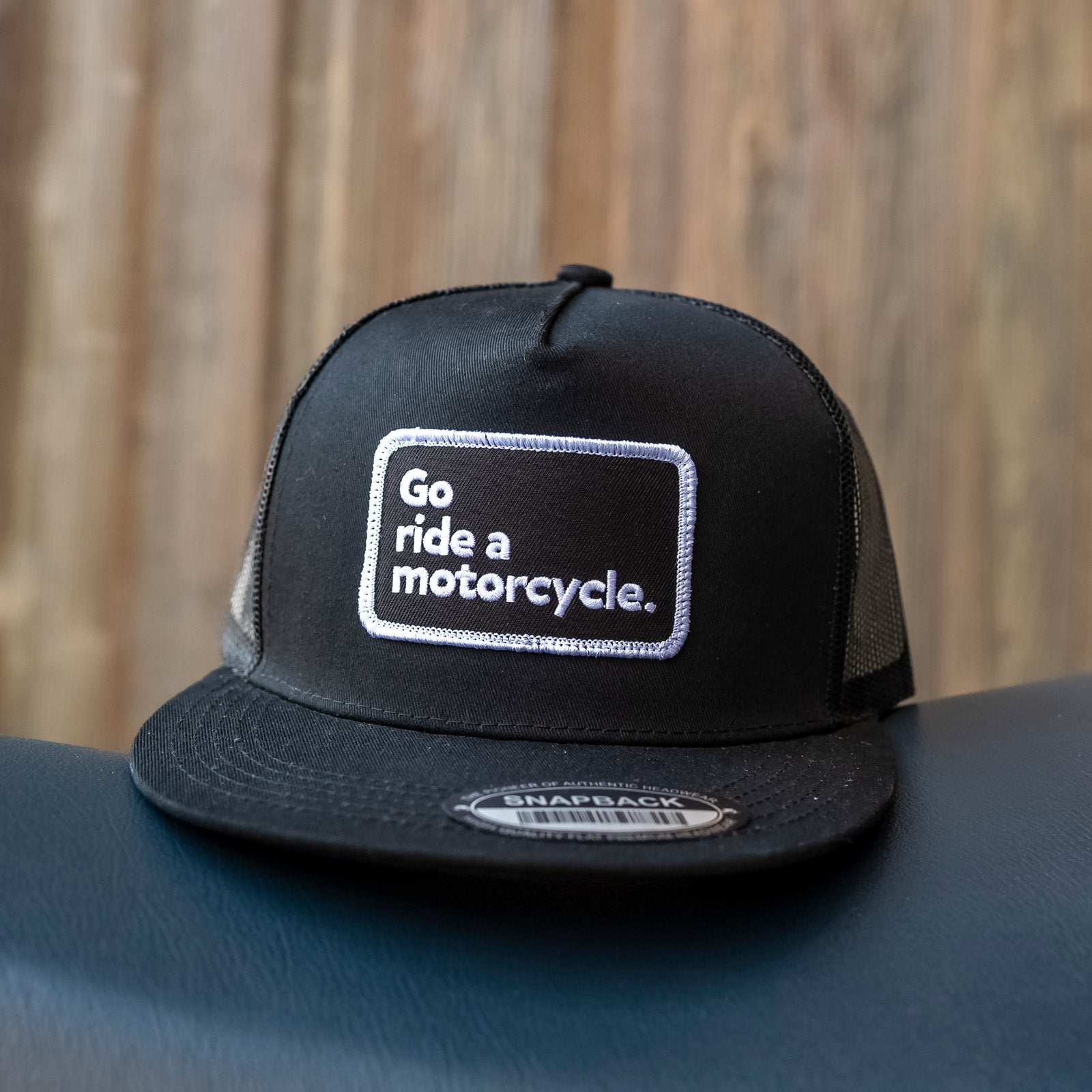 "Go ride a motorcycle" Black on Black Snapback Trucker Hat, nickel metal rivet on back, crown moto brand