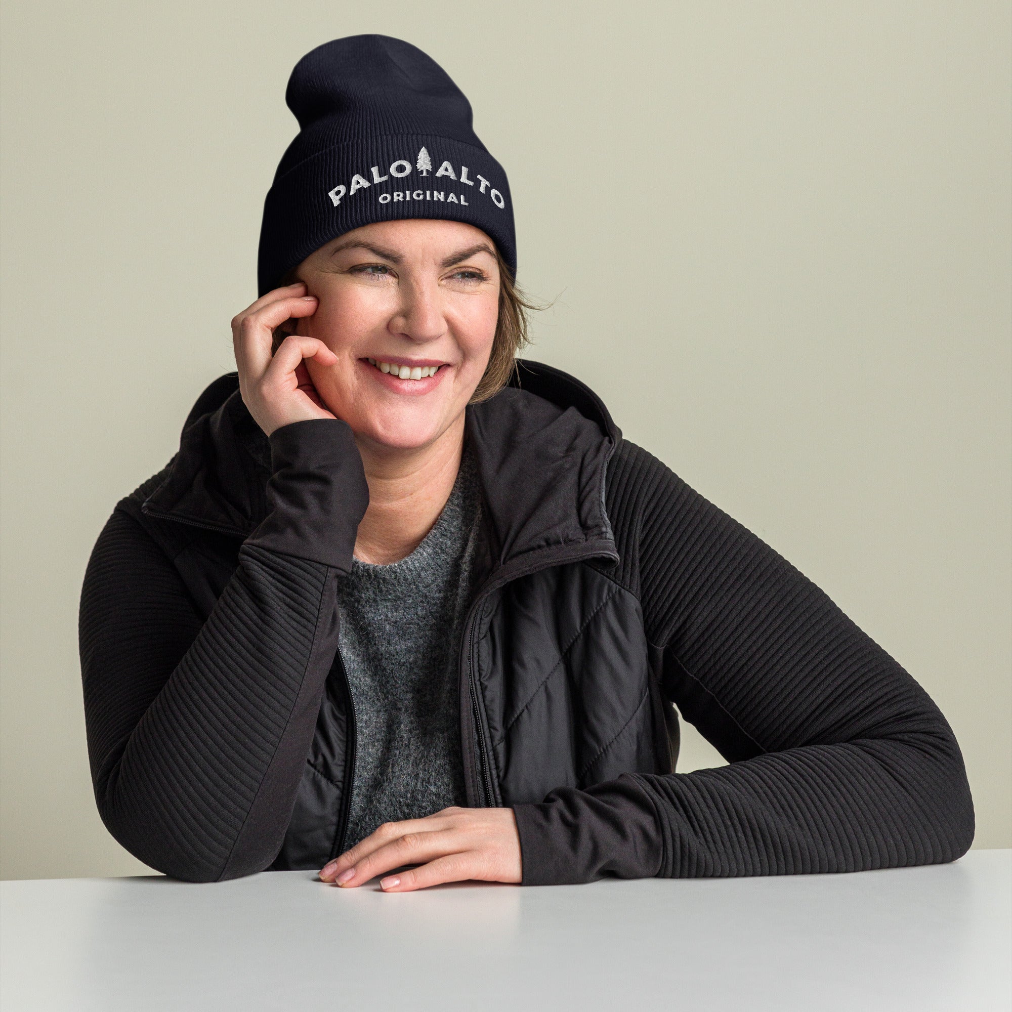 Woman wearing navy blue Palo Alto Original fine ribbed knit beanie