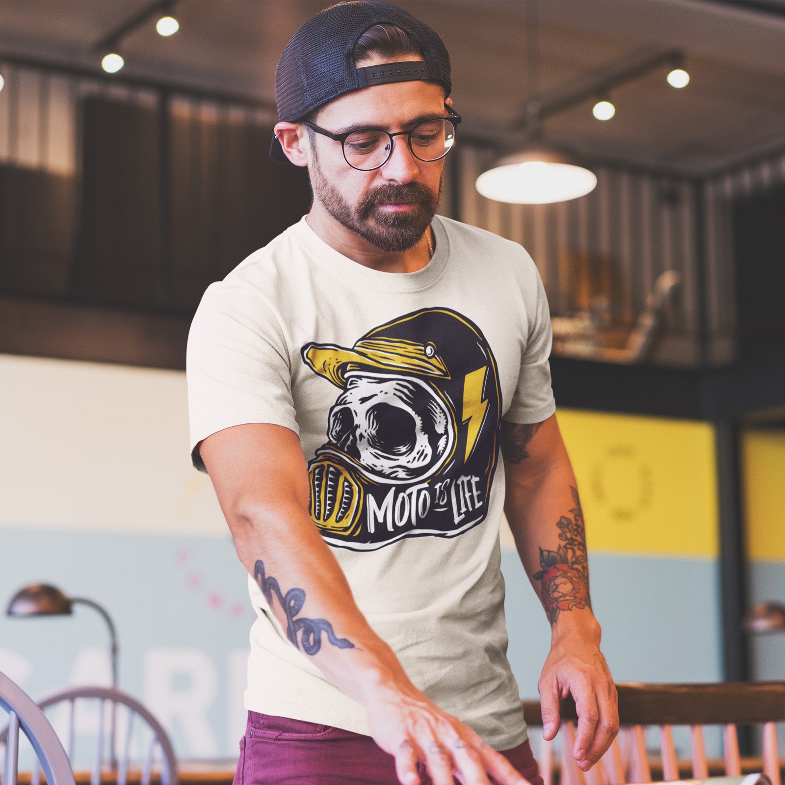 Male model wearing a Moto is Life - Solid Skull T-Shirt design on vintage white shirt, motorcycles, motorbikes, ride for life, crown moto