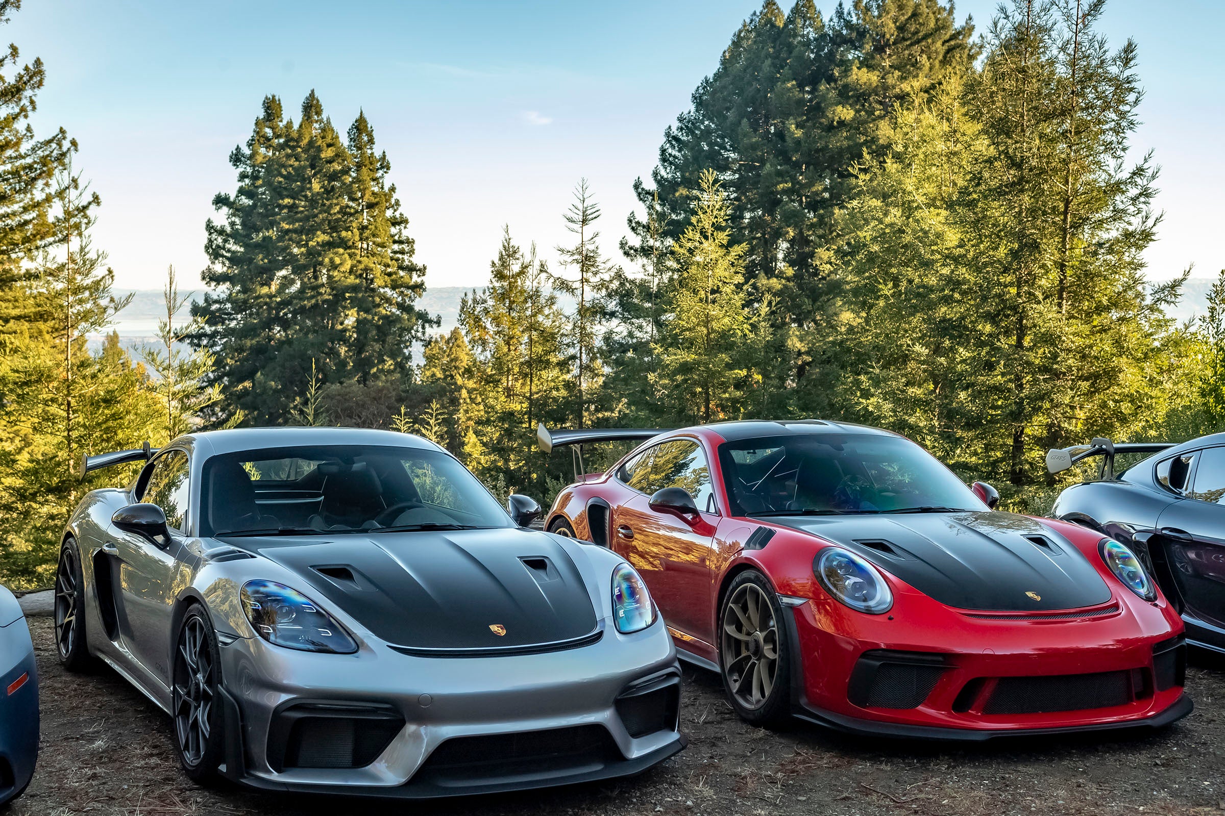 two gt3RS porsches at a cars and coffee event in woodside california