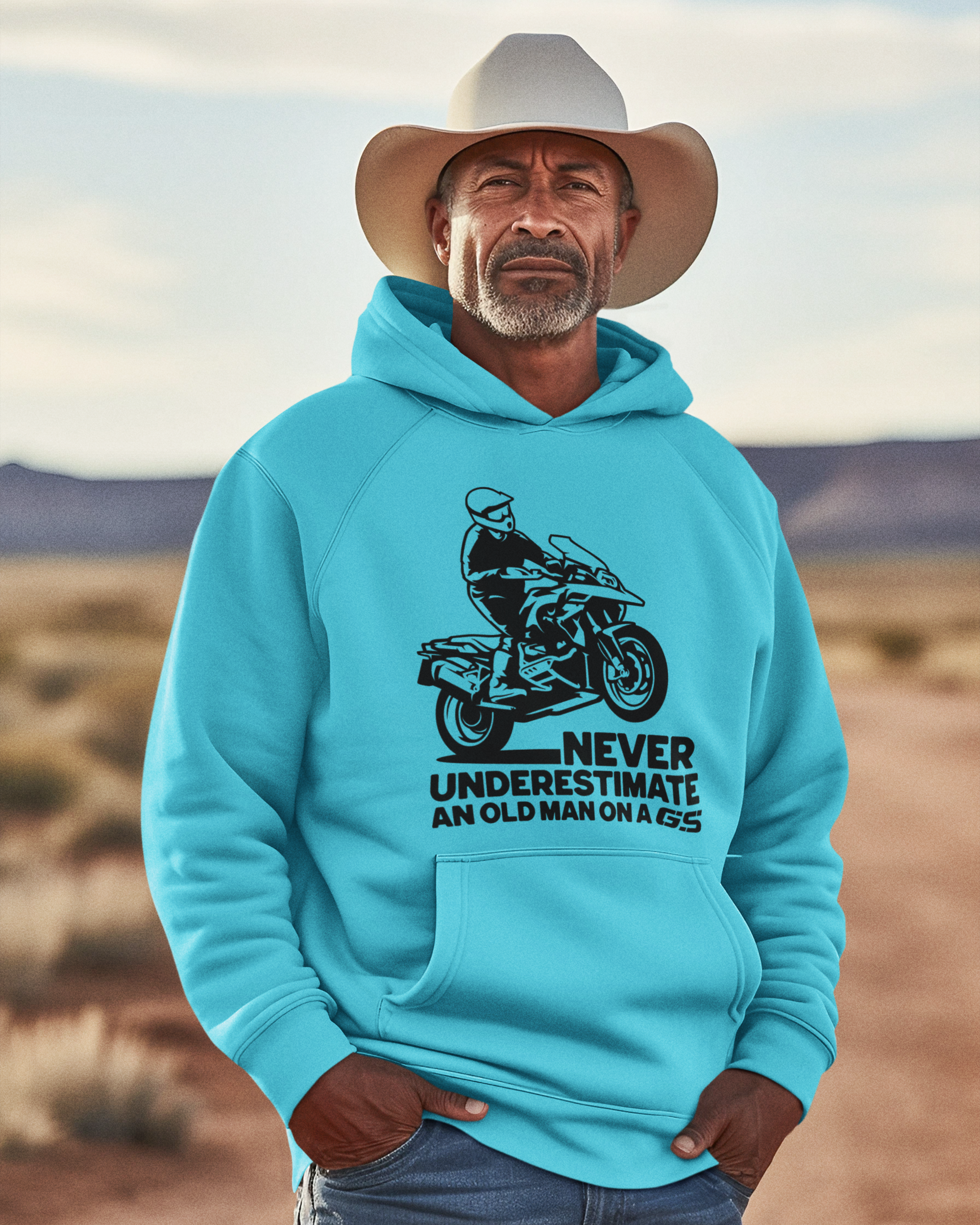 Image of a man in a cowboy hat wearing a light blue GS hoodie