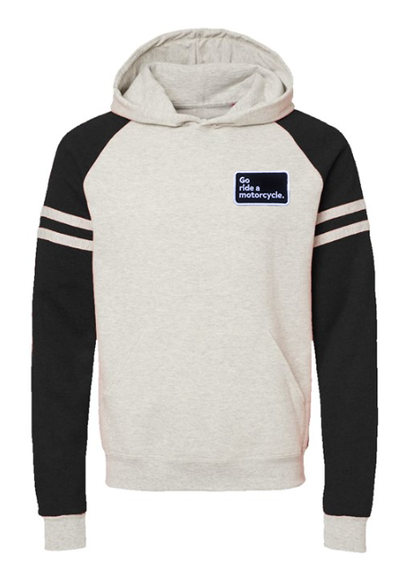 "Go ride a motorcycle" patch sewn on left chest of raglan varsity striped sleeve pullover hoodie