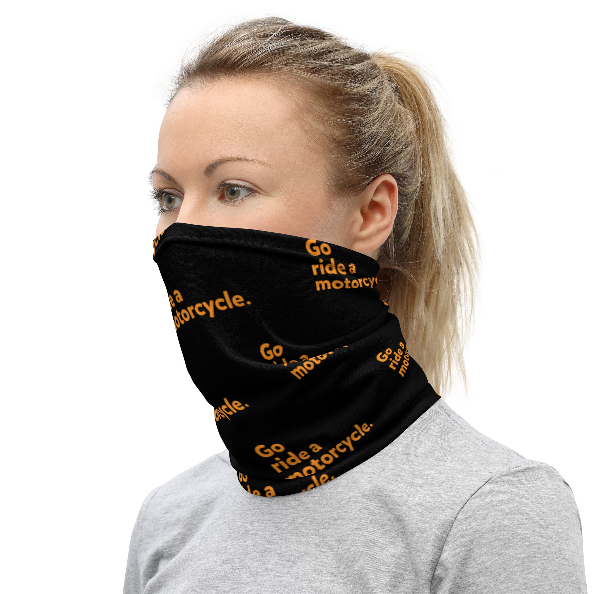 Orange "Go ride a motorcycle" repeated at an angle on premium neck gaiter sleeve