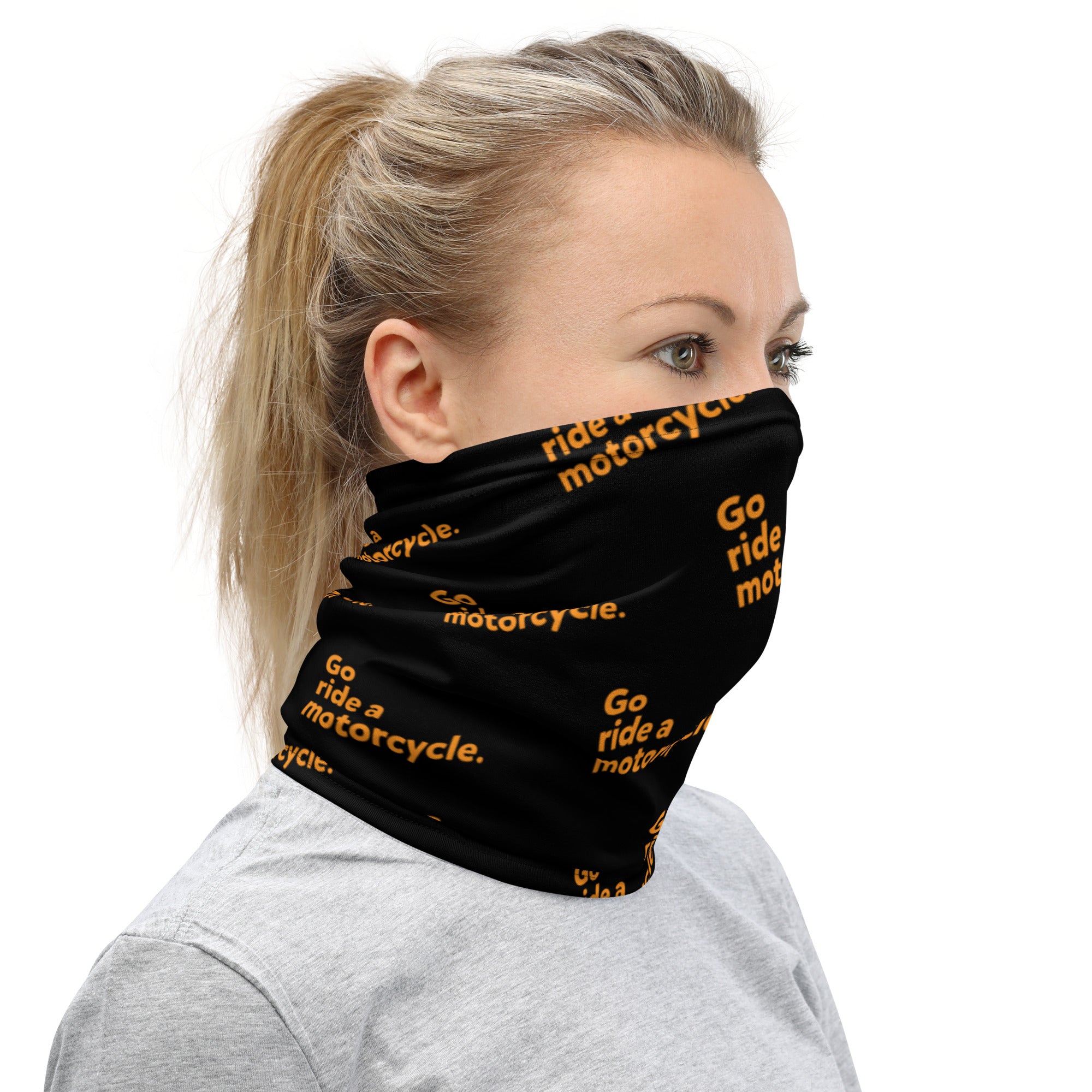Orange "Go ride a motorcycle" repeated at an angle on premium neck gaiter sleeve