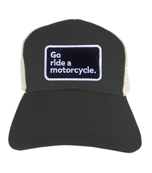 "Go ride a motorcycle" patch sewn on front of eco-friendly snapback trucker hat