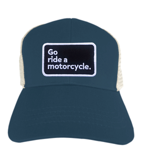 "Go ride a motorcycle" patch sewn on front of eco-friendly snapback trucker hat