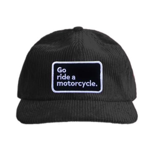 "Go ride a motorcycle" patch sewn on front of this premium corduroy buckle adjustment hat