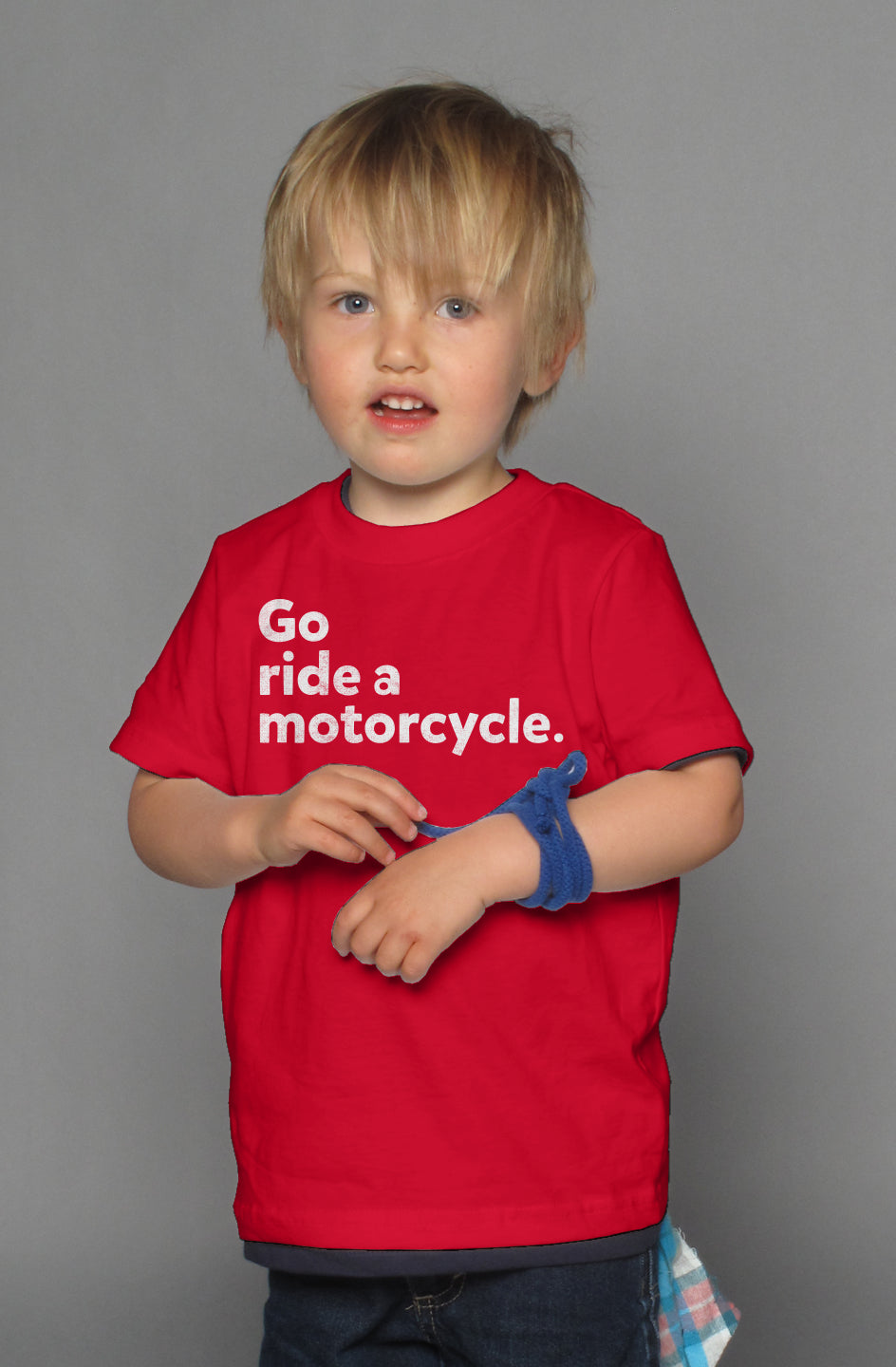 "Go ride a motorcycle" design printed in white on chest of kid's short sleeve t-shirt