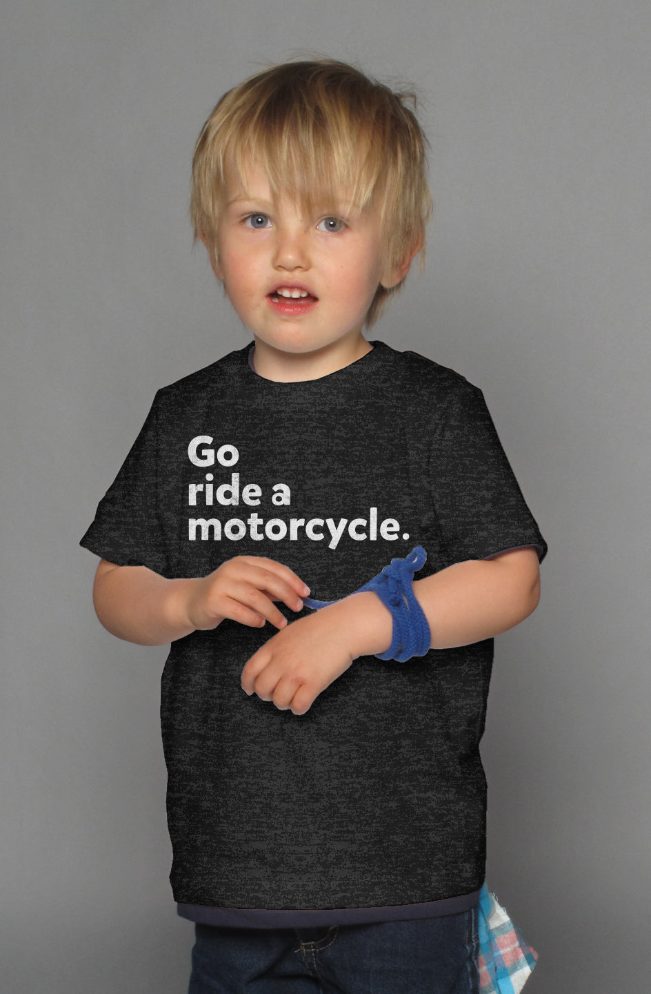 "Go ride a motorcycle" design printed in white on chest of kid's short sleeve t-shirt