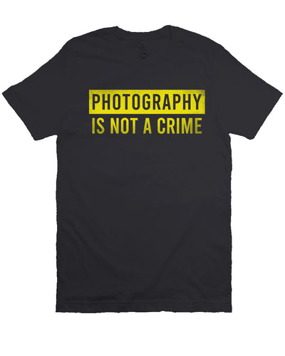 short sleeve t-shirt with "photography is not a crime" in yellow on chest