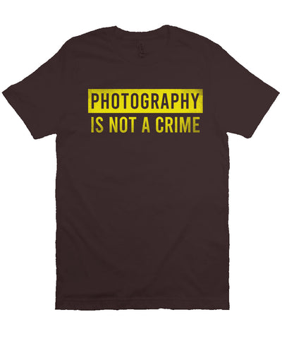 short sleeve t-shirt with "photography is not a crime" in yellow on chest