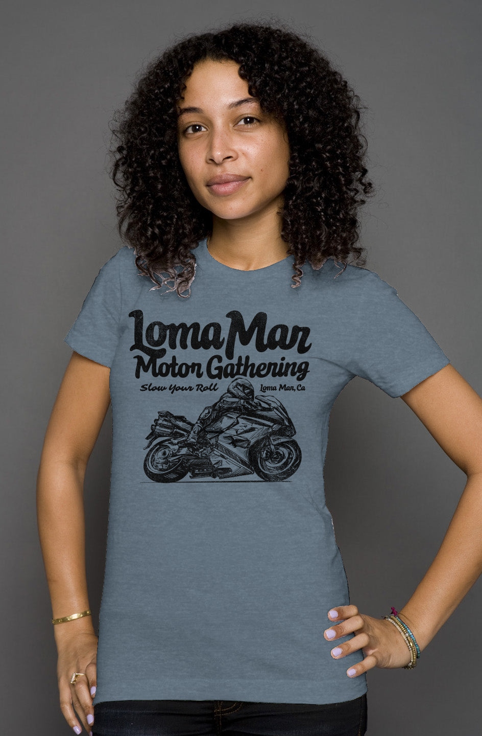 Attractive woman wearing short sleeve t-shirt with "Loma Mar Motor Gathering" moto sketch design on chest