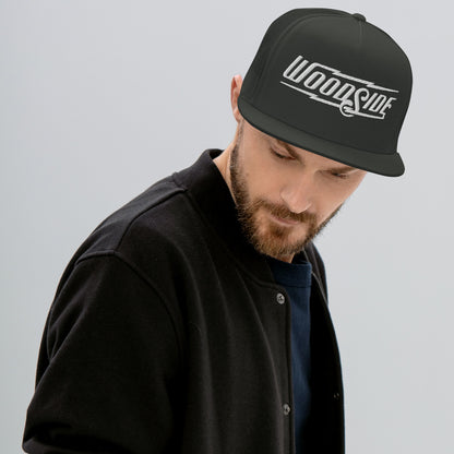 Man wearing Woodside Brand embroidered snapback trucker hat with white embroidery