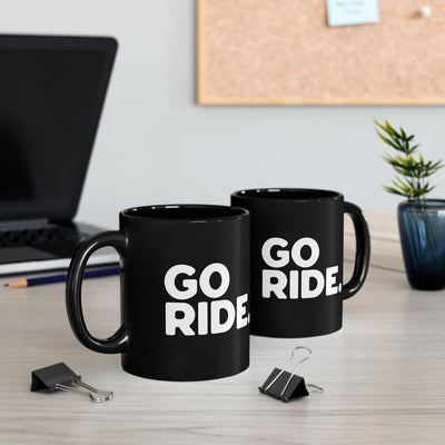 go ride black ceramic coffee mug for motorcycle riders and adventurers, mountain bikers, two mugs sitting on a desk