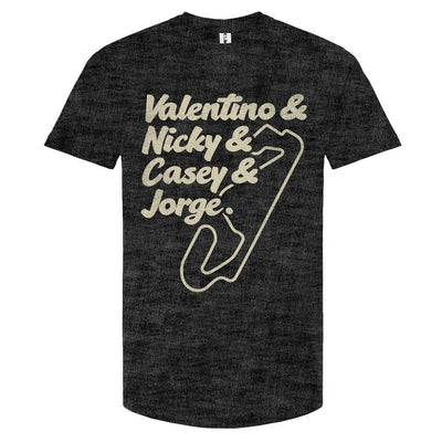 A navy blue crewneck t-shirt with text and a graphic design in a cream color. The text lists 'Valentino & Nicky & Casey & Jorge' with a stylized representation of a motorcycle track beneath it.