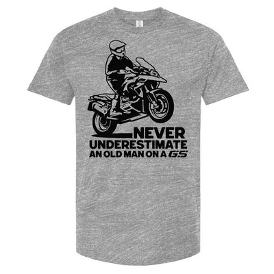 T-shirt with a man wheelieing on a GS motorcycle sitting proudly with text below saying "never underestimate an old man on a gs"