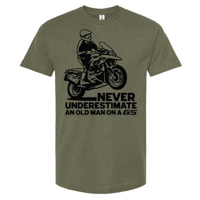 Green crew neck t-shirt with graphic print of a person on a motorcycle and the text 'NEVER UNDERESTIMATE AN OLD MAN ON A GS'.