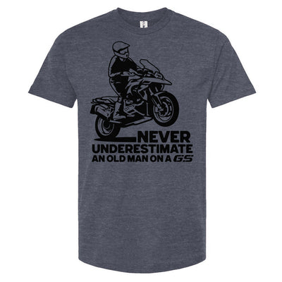 T-shirt with a man wheelie on a GS motorcycle sitting proudly with text below saying "never underestimate an old man on a gs"