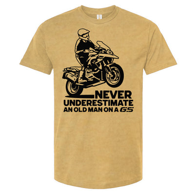 T-shirt with a man wheelie on a GS motorcycle sitting proudly with text below saying "never underestimate an old man on a gs"