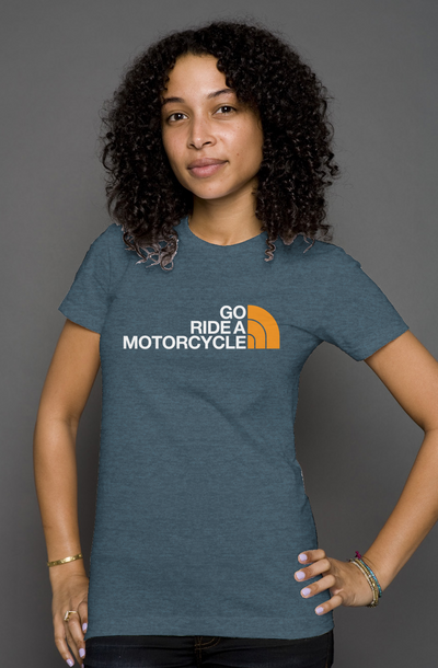 Woman wearing a blue t-shirt with 'Go Ride a Motorcycle' text and parody logo