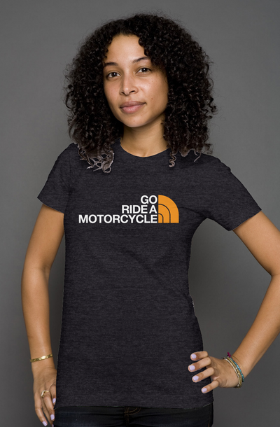 Woman wearing a black t-shirt with 'Go Ride a Motorcycle' text and parody logo