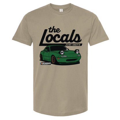 Sand colored t-shirt with a graphic of a green Mazda Miata and 'the Locals' text on a white background