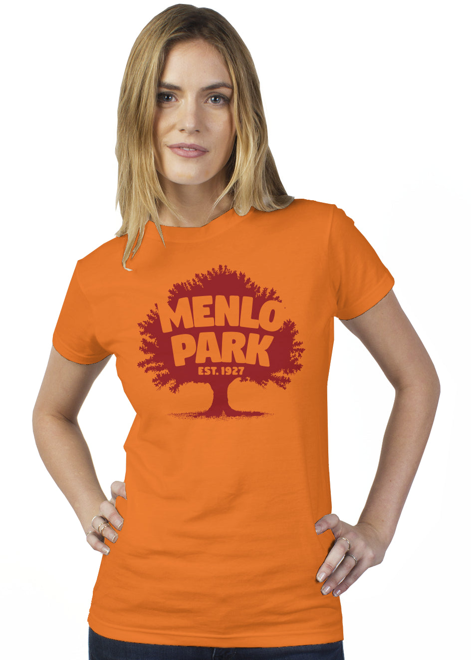 Woman wearing an orange t-shirt with 'Menlo Park' printed on it against a white background