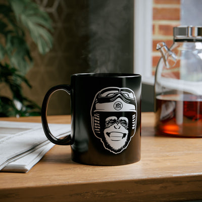moto monkey design from crown moto in white ink on black ceramic mug sitting on a wood shelf with steam coming out of the top, motorcycle lifestyle, motorbikes, gifts for riders, gifts for him, gifts for her, gifts for motorcyclists