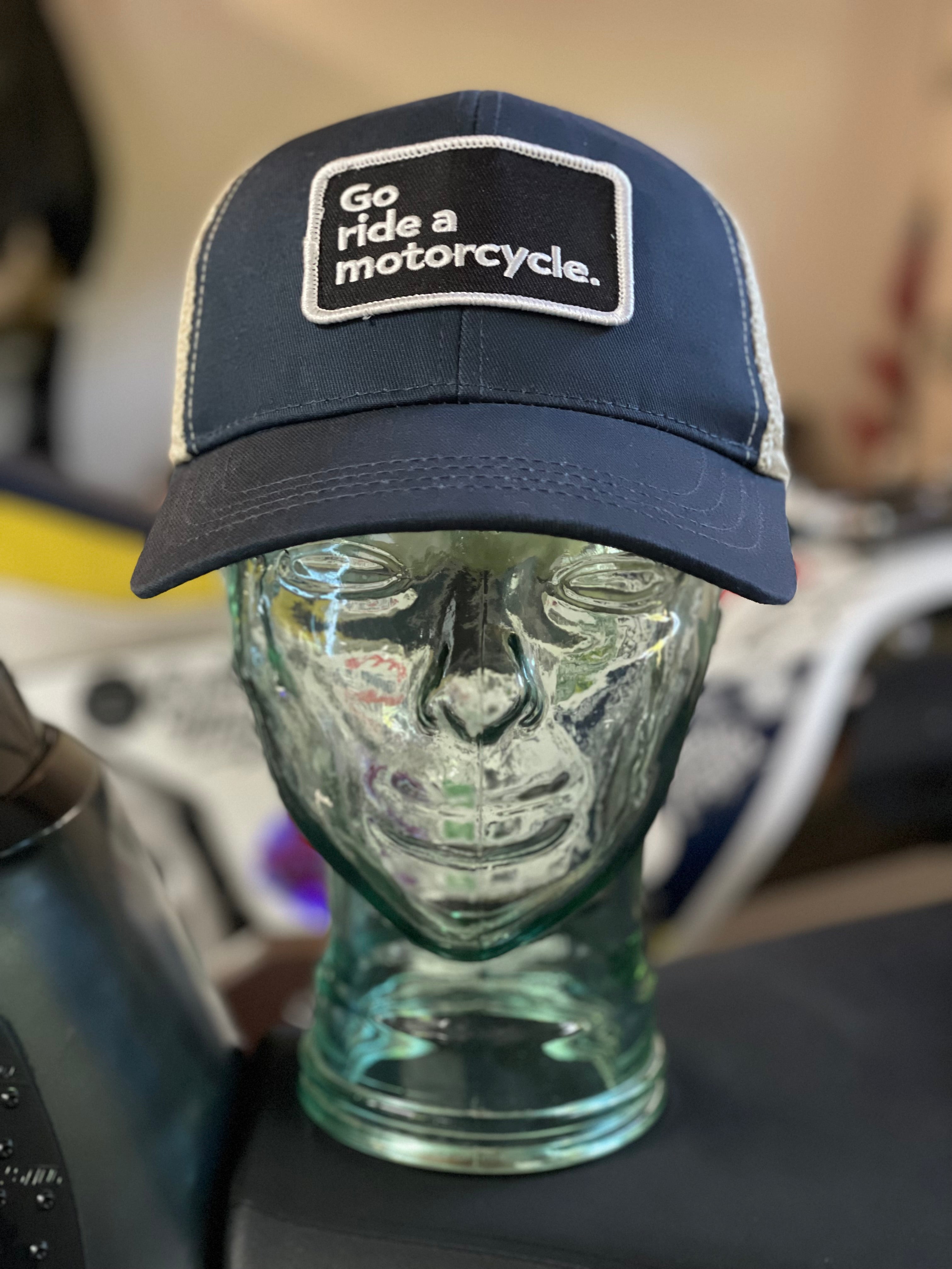 "Go ride a motorcycle" navy snapback trucker hat from Crown Moto