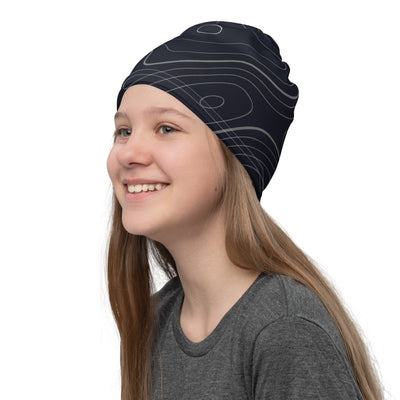 Topographic design on dark blue neck gaiter being worn as a hat