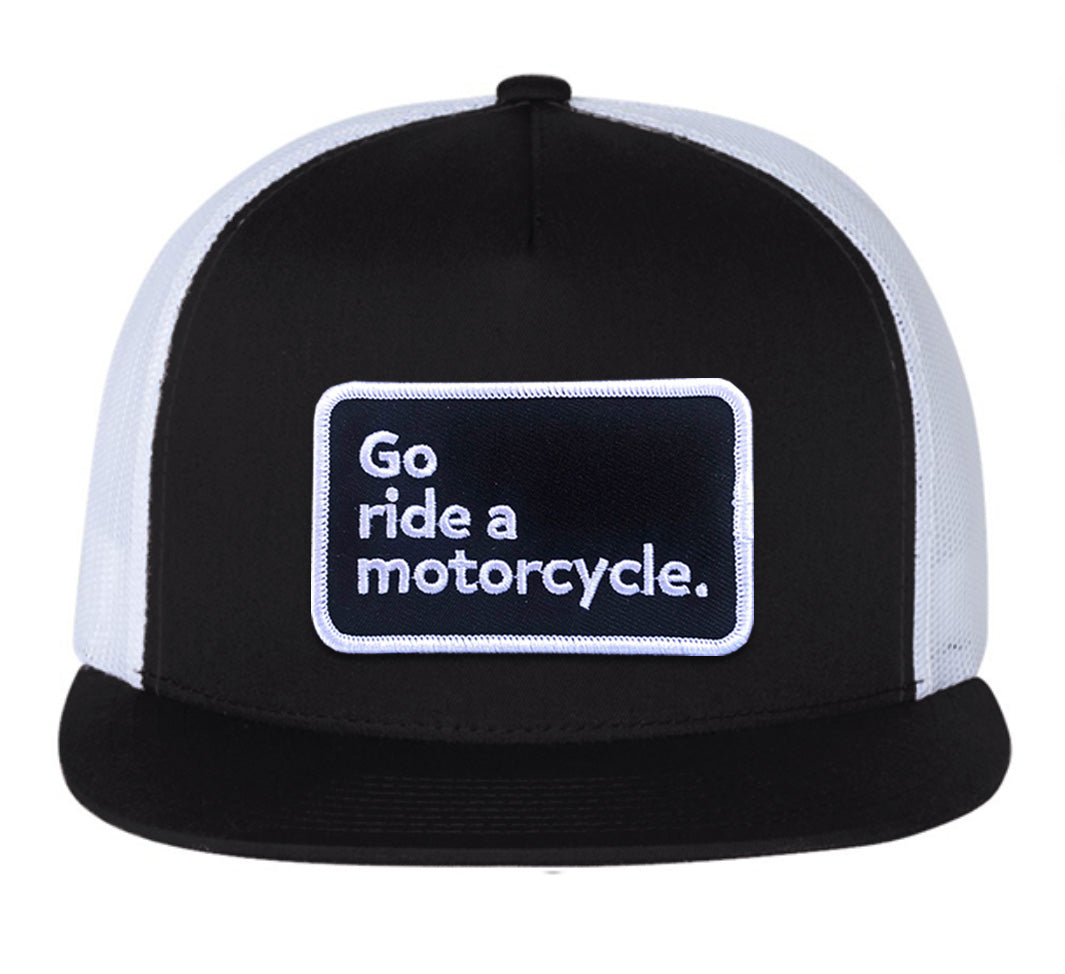 Black and white cap with 'Go ride a motorcycle.' embroidered patch on front