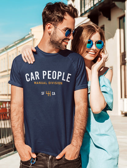 Man wearing a navy blue short sleeve t-shirt with "CAR PEOPLE" manual division SF design on chest 