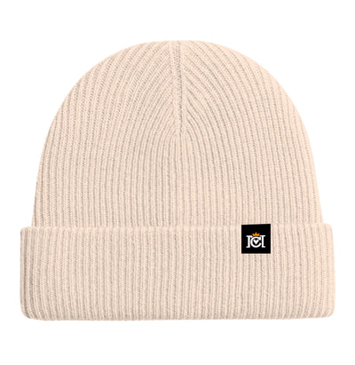 Cream colored cashmere beanie with a small Crown Moto woven logo patch sewn to top cuff