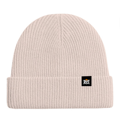 Oatmeal colored cashmere beanie with a small Crown Moto woven logo patch sewn to top cuff