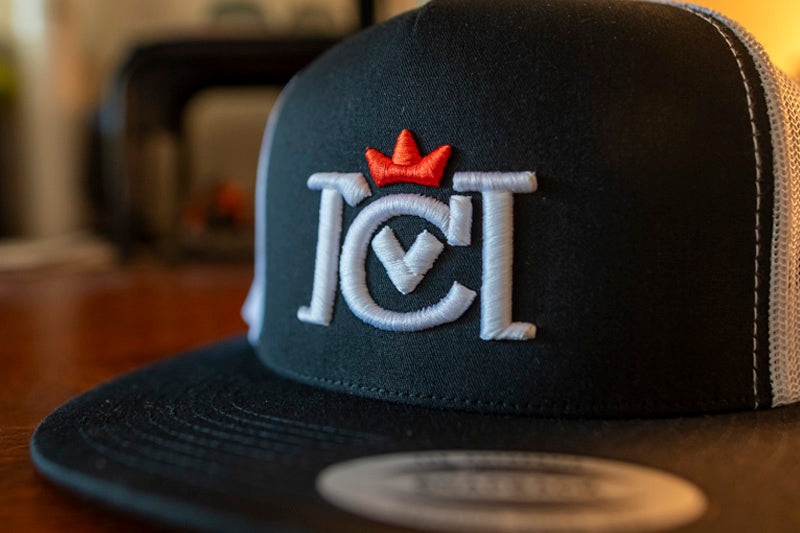 Trademarked Crown Moto logo embroidered in 3d puff style on front of snapback trucker hat