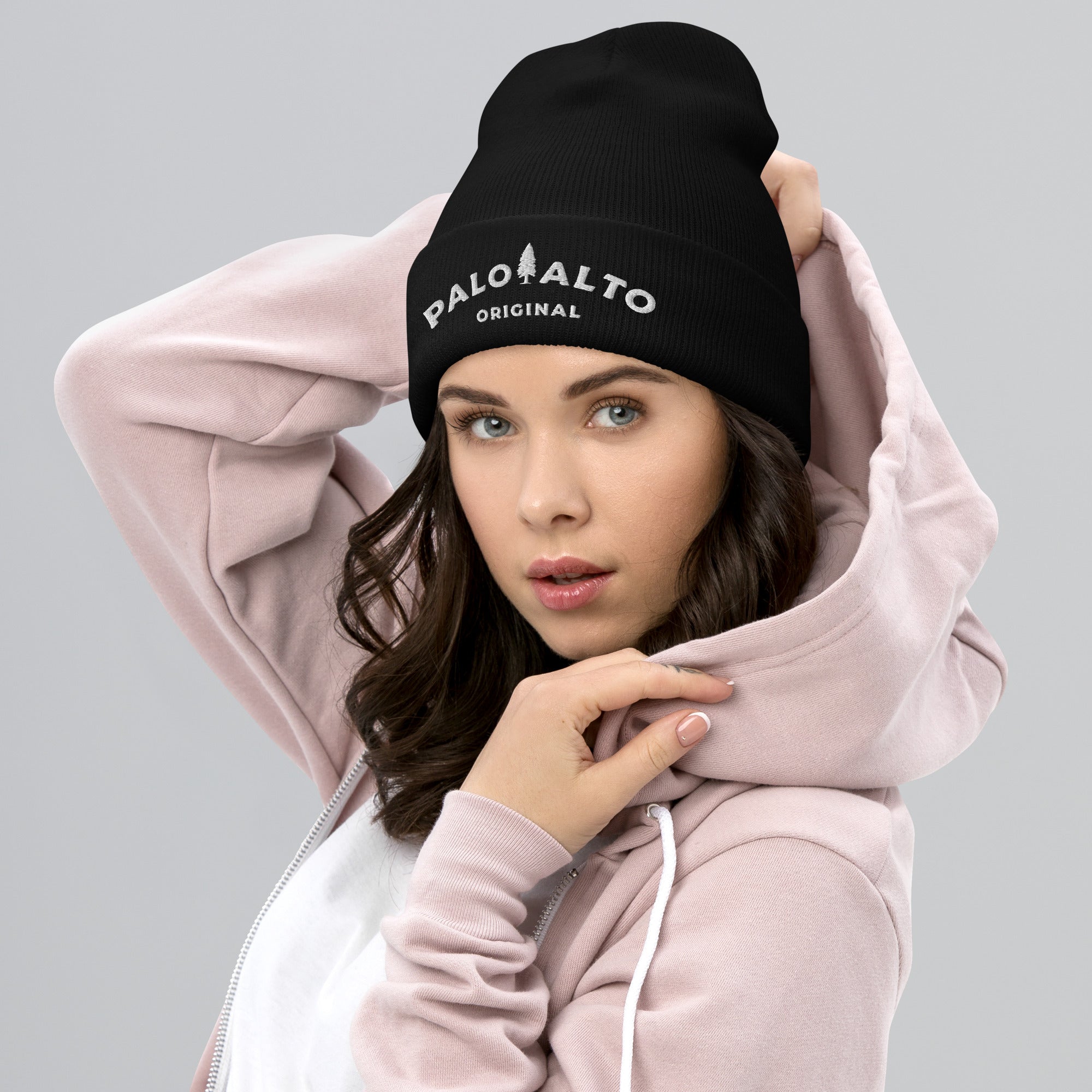 Woman wearing a black Palo Alto Original fine ribbed knit beanie