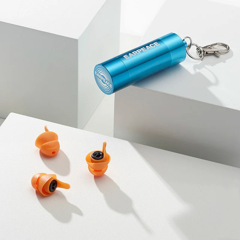 Orange earplugs with a blue case labeled 'EARPEACE' on a white surface.