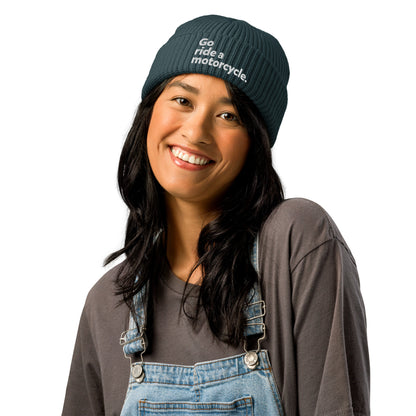 Woman wearing blue Go ride a motorcycle embroidered fisherman beanie
