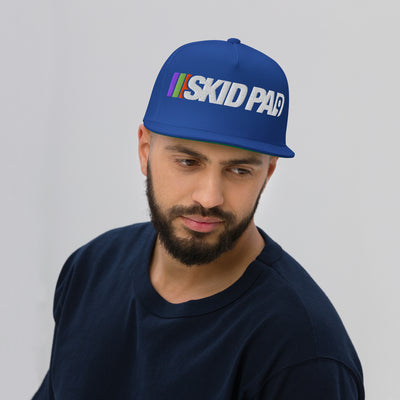 Man wearing Skid Pad 9 embroidered hat