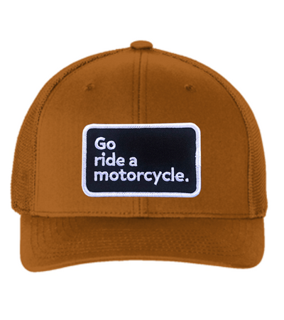 "Go ride a motorcycle" patch sewn on front of flexfit trucker hat