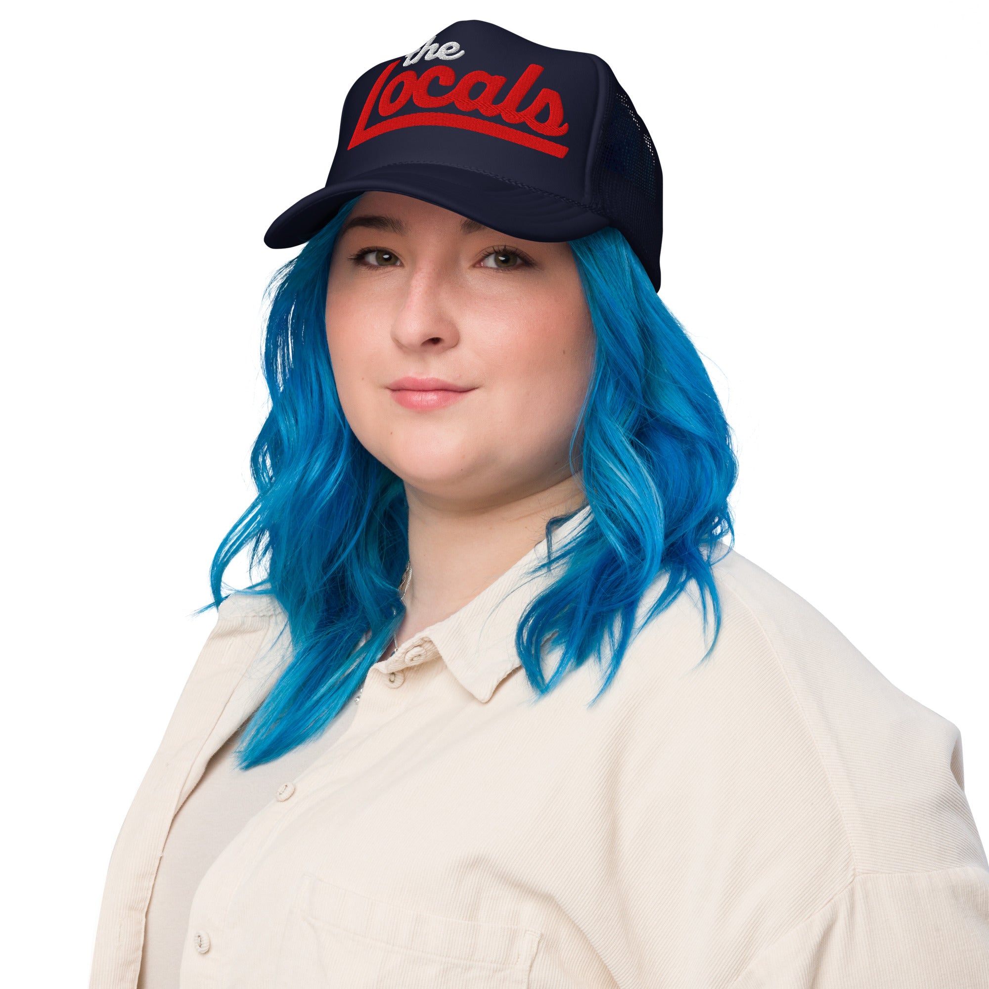 Woman wearing the Locals logo design embroidered on front of foam trucker hat