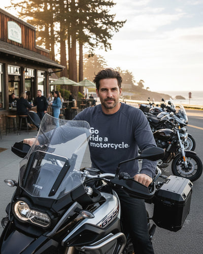 Man on adventure motorcycle wearing blue "Go ride a motorcycle" raglan long sleeve t-shirt from Crown Moto