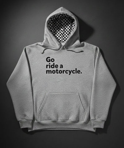 Gray hoodie with 'Go ride a motorcycle.' text and checkered flag lined hood on a dark background